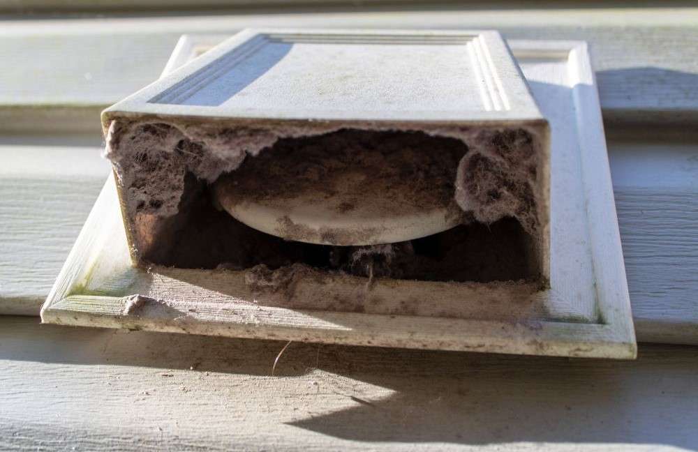 dryer vent covered in dust build up