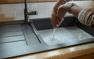 cleaning clog in kitchen sink